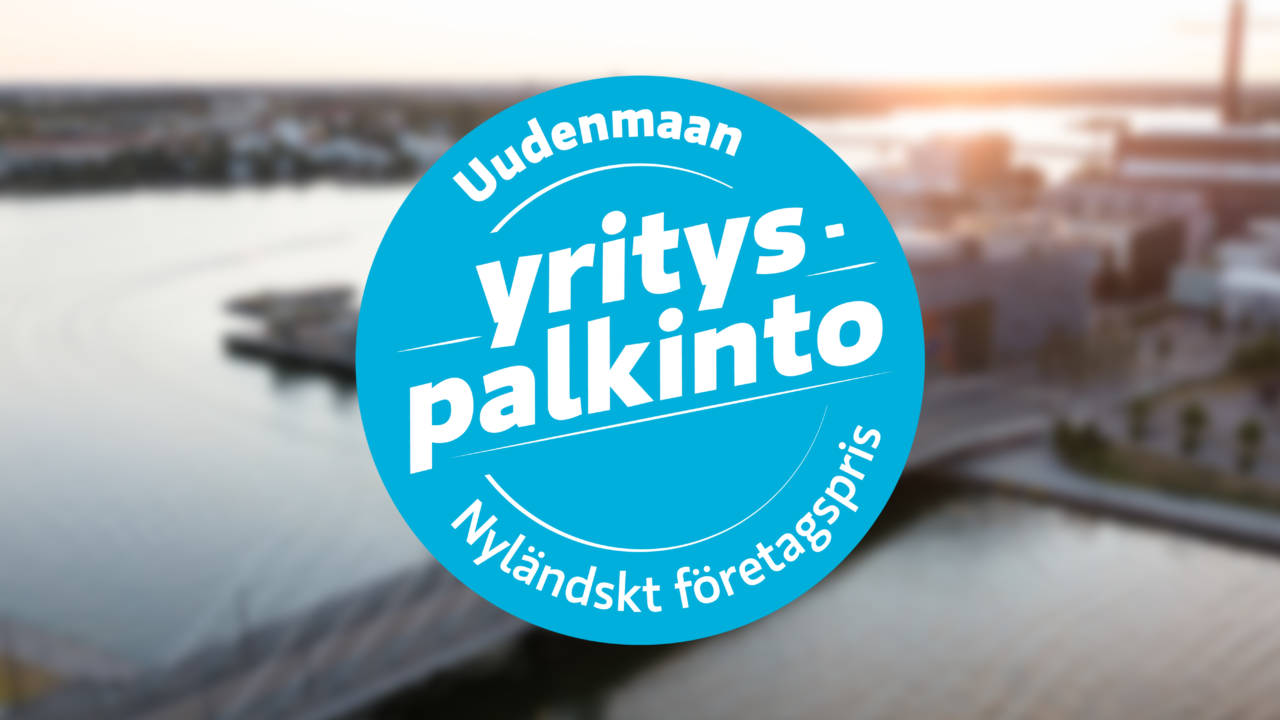 Sininen ympyrä, jossa tekstit Uudenmaan yrityspalkinto, Nyländskt företagpris.