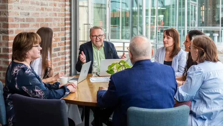 Group of people having a conversation.
