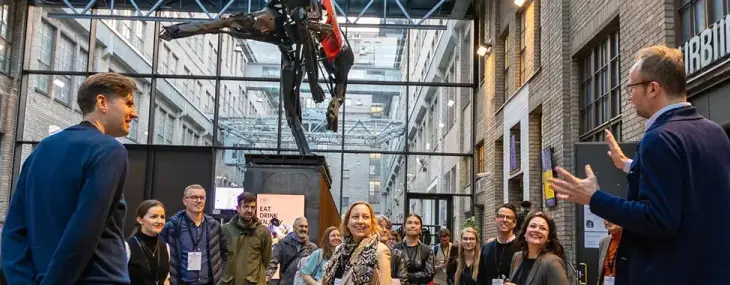A group of people at the Cable Factory culture centre in Helsinki.
