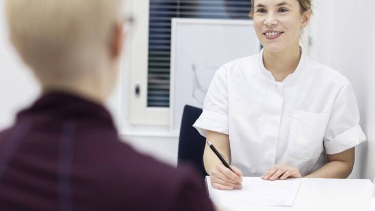 A patient visiting a nurse or a doctor.
